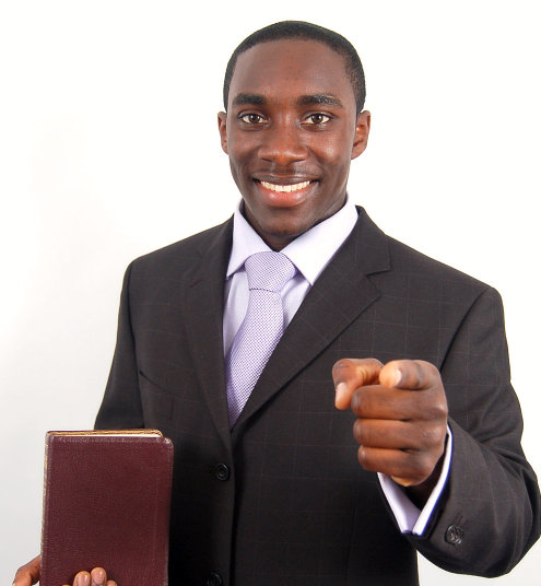 man pointing his finger while with his bible